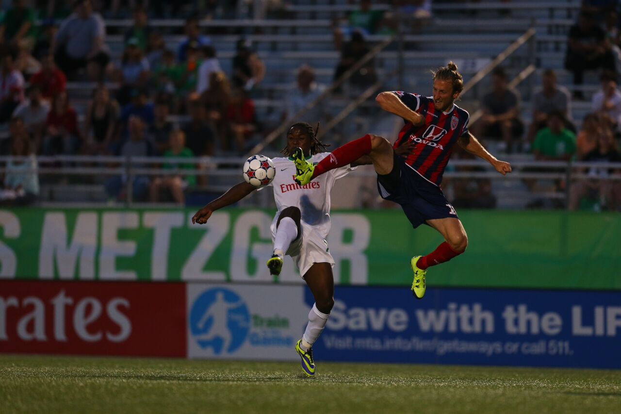 Cory Miller Challenges Lucky Mkosana For A Ball (Photo Credit: NY Cosmos)