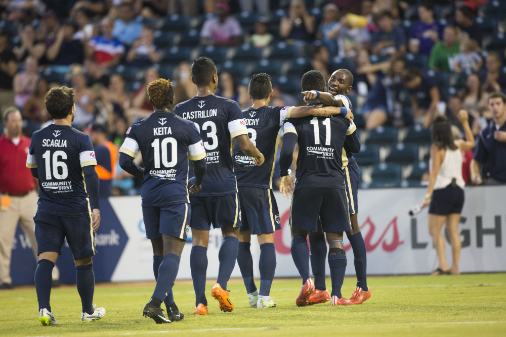 Jacksonville players approach Akeil Barrett after his goal. (Photo: Jacksonville Armada FC)