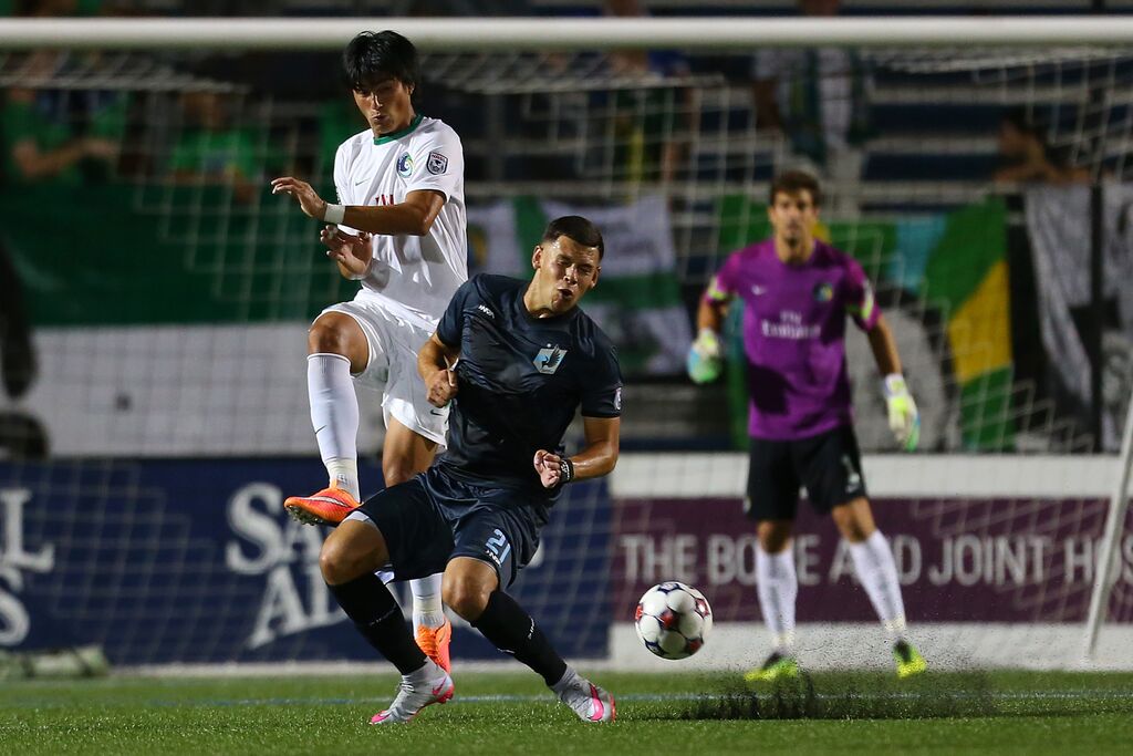 Samuel Caceres and Christian Ramirez tangle for a ball as Jimmy Maurer looks on (Photo: New York Cosmos)