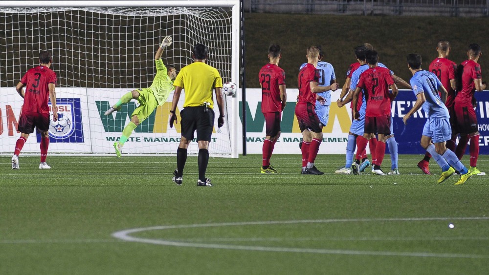 Romuald Peiser stretches toward the shot from Daniel Mendes' last second free kick. (Photo: Steve Kingsman/Ottawa Fury FC)